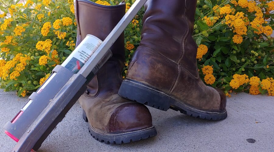 tools of the trade for a private utility locator including work boots and gpr wand